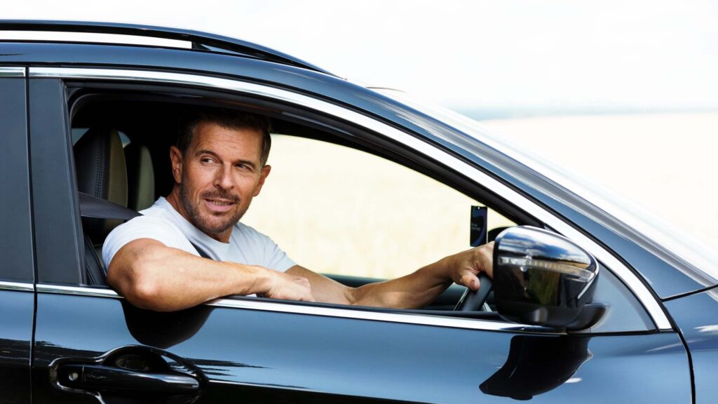 A man driving a car