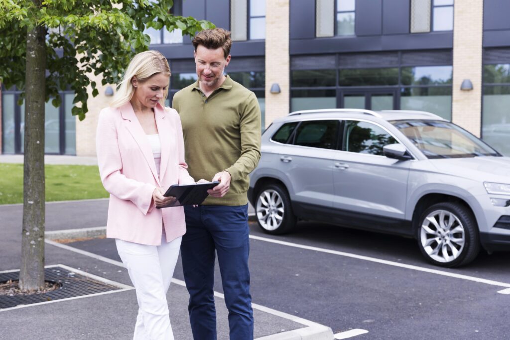 Two people looking at their insurance policy on an ipad