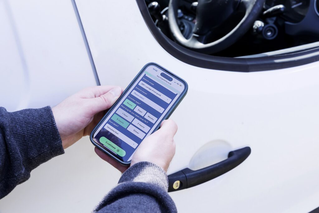A close up of someone using GoShorty's Car Insurance App